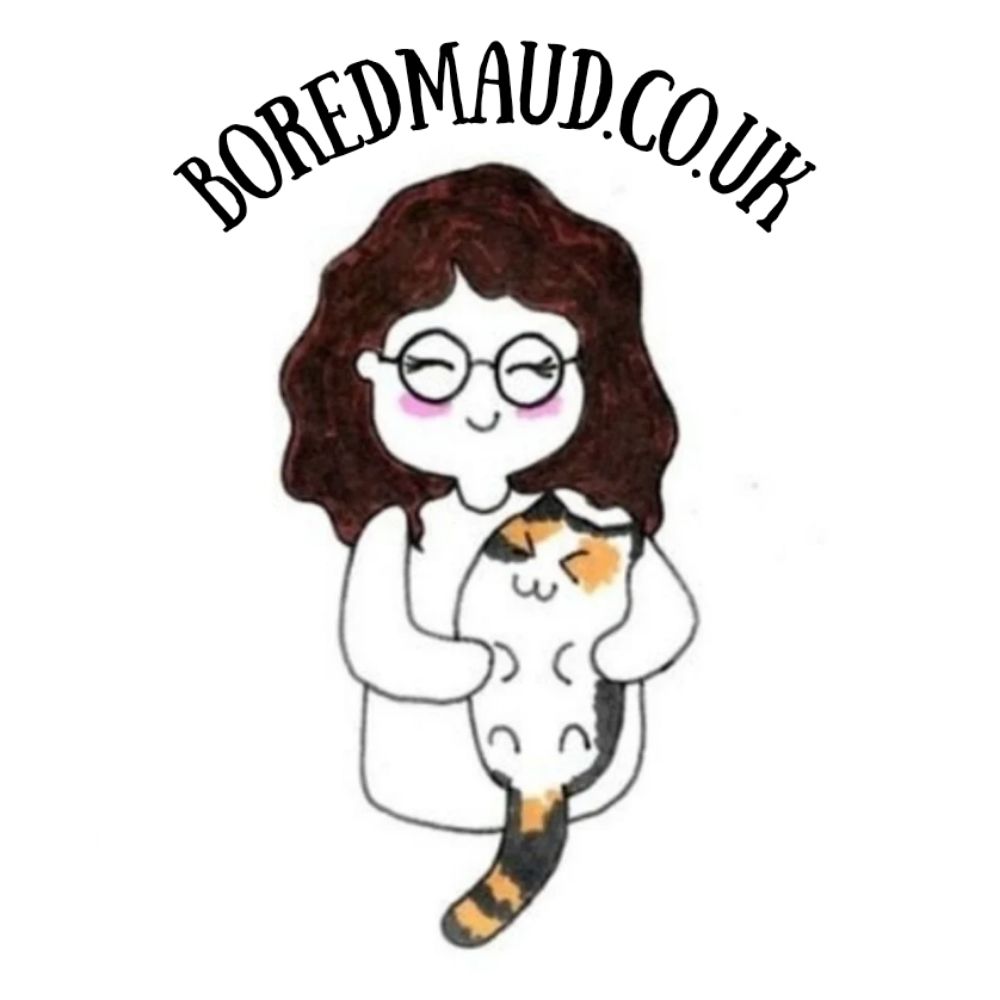 The logo for BoredMaud.co.uk. It features the words 'BoredMaud.co.uk' arcing over a minimalist doodle of a smiling woman with brown, curly hair holding a calico cat.